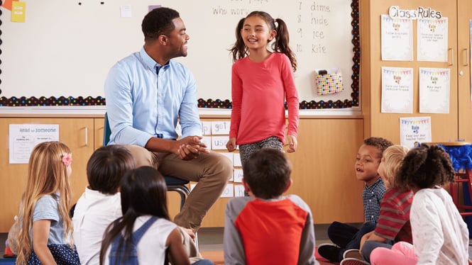 Children and teacher engaged in play in a positive early childhood learning environment.